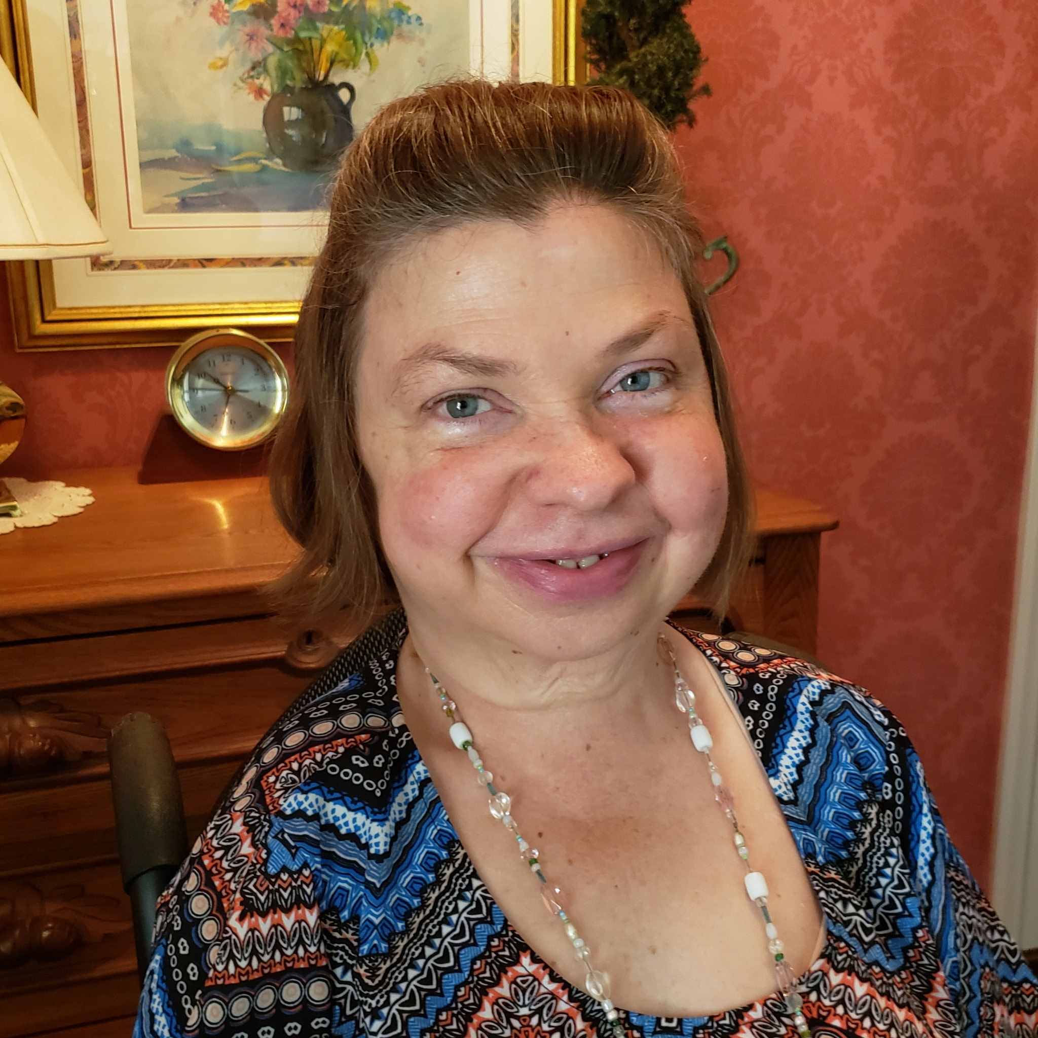 Senior woman smiling warmly at home with vintage decor — Peaceful Place Home Care, Matthews NC